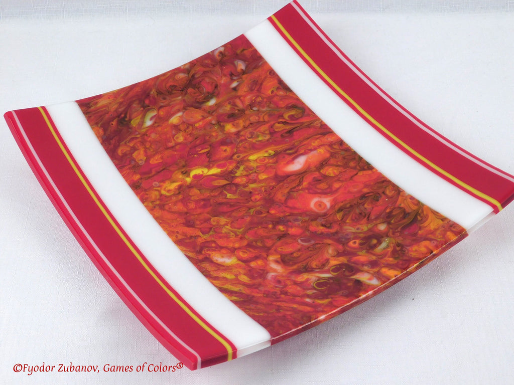 A decorative fused glass plate "Fire taming"