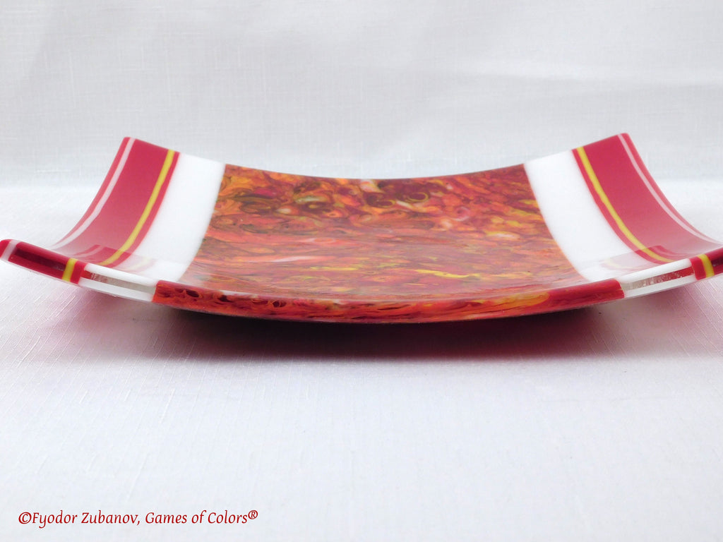 A decorative fused glass plate "Fire taming"