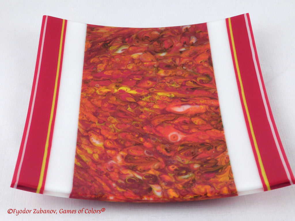 A decorative fused glass plate "Fire taming"