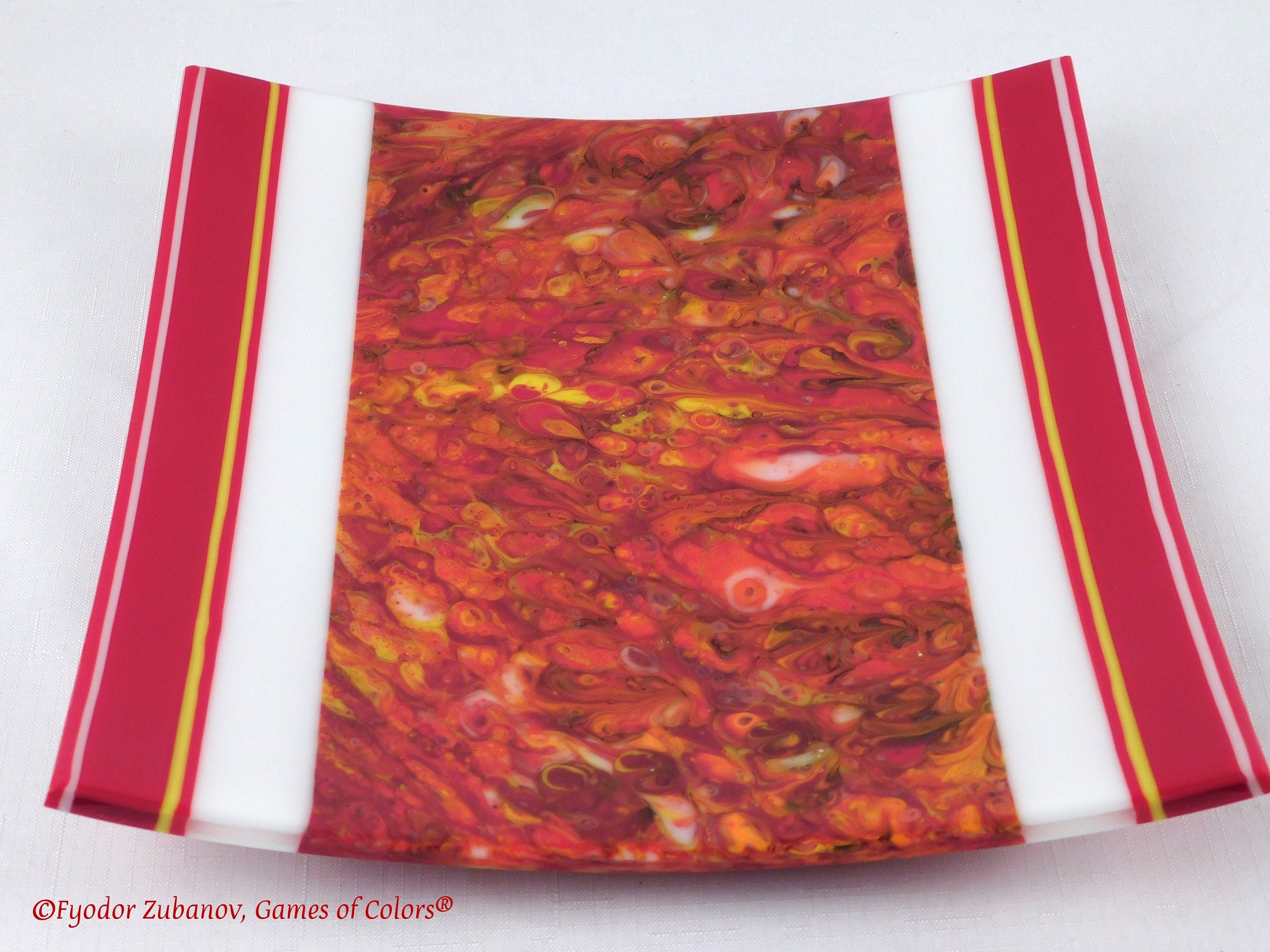 A decorative fused glass plate "Fire taming"