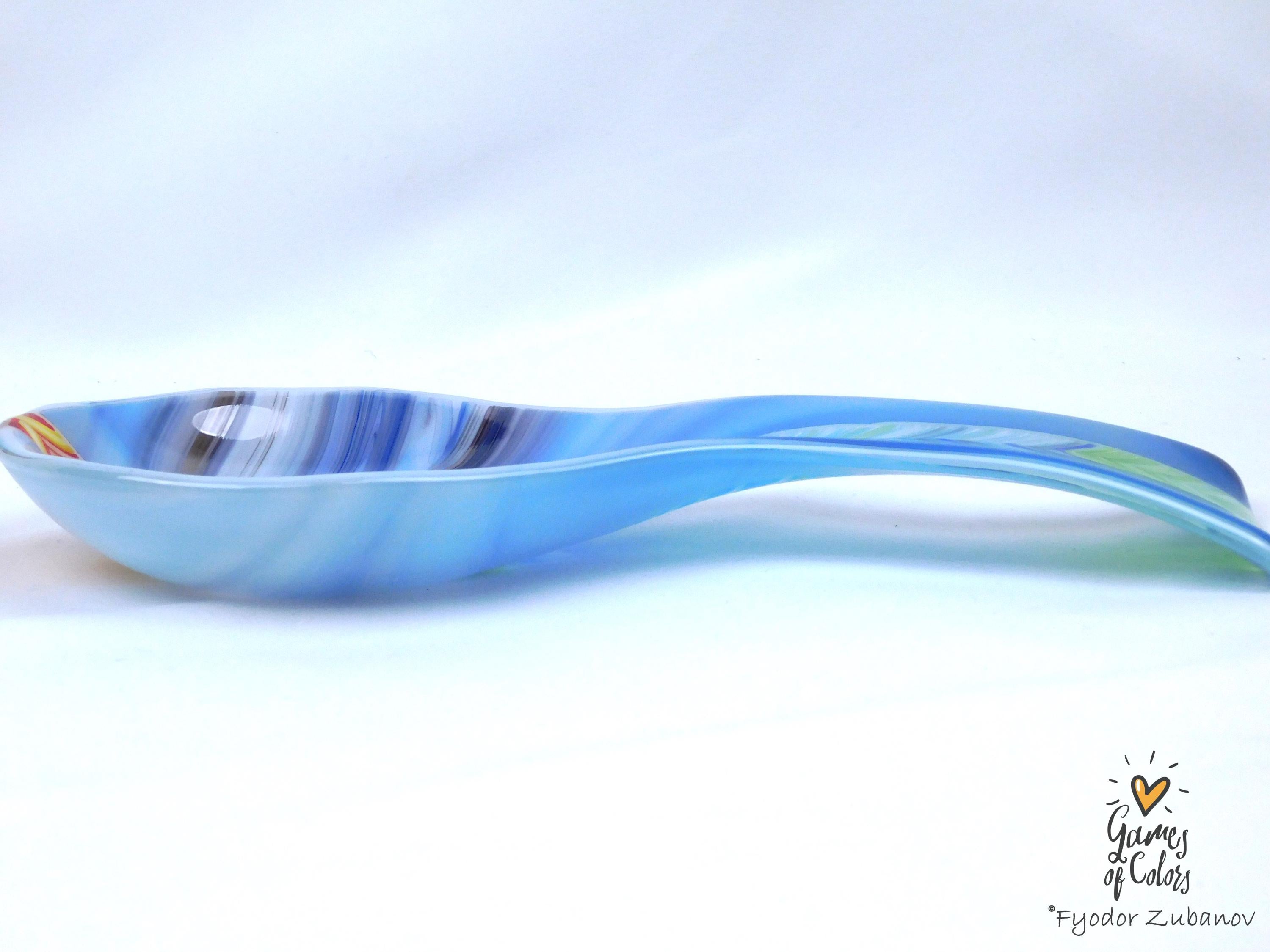 A fused glass decorative spoon rest "Spectrum Leap"