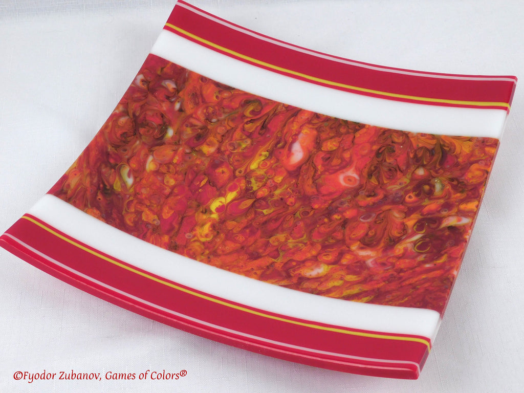 A decorative fused glass plate "Fire taming"