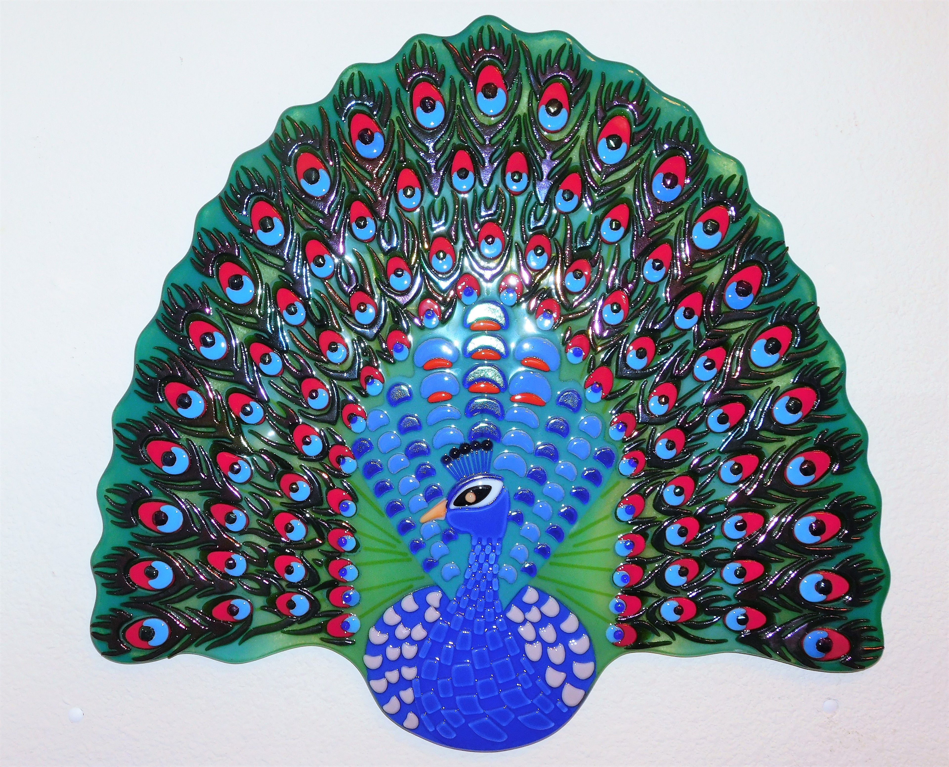 A decorative wall panel "A Peacock"