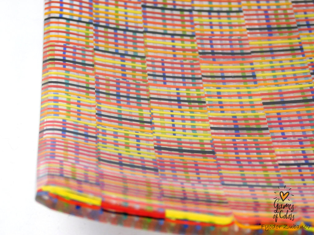 A square glass plate imitating fabric with a vibrant, multicolored geometric pattern featuring diagonal stripes and mesh-like textures in yellow, blue, green. and a watermark in the bottom right corner reads 'Fyodor Zubanov' and 'Games of Colors'.