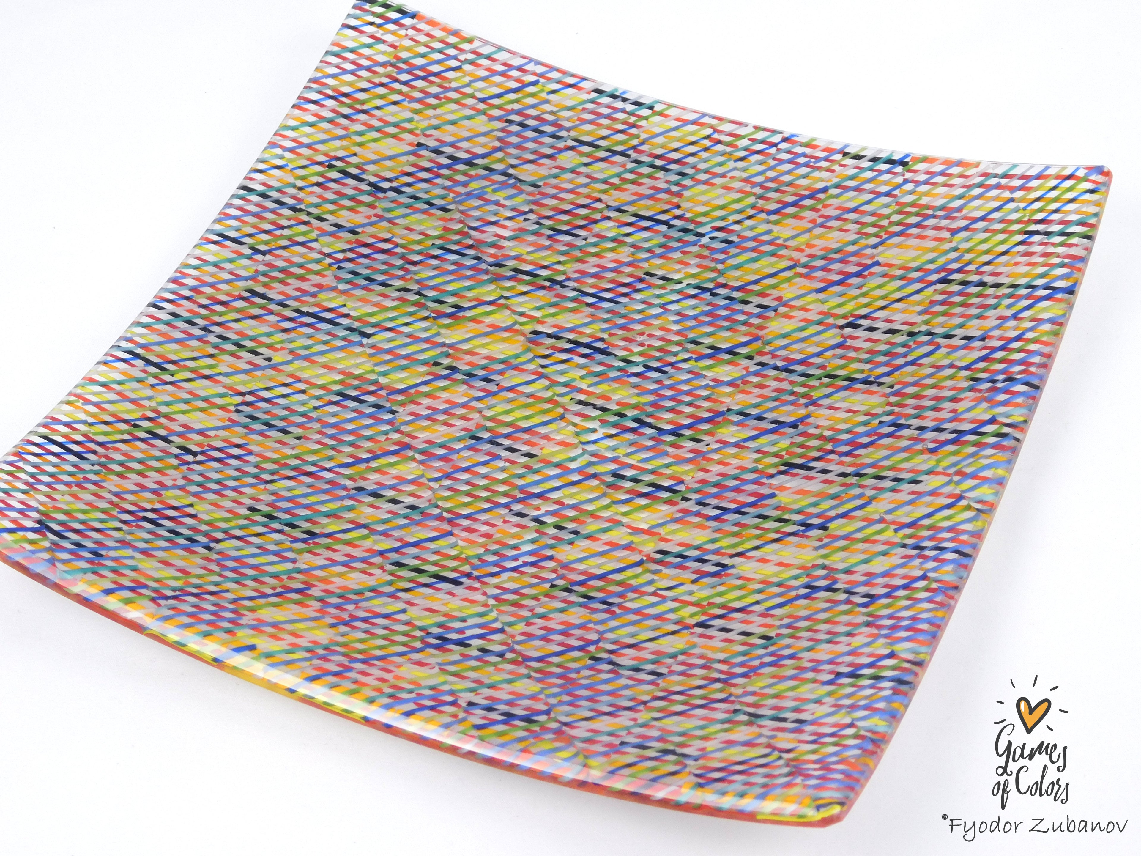 A square glass plate with rounded corners, featuring a vibrant multicolor pattern of intersecting wavy lines in pink, blue, yellow, green, and orange, photographed on a white background with a 'Gumay of Candy' watermark in the bottom right corner.