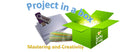 Green box labeled 'Project in a box' with a USB drive, papers, and colorful ribbons on a white background.