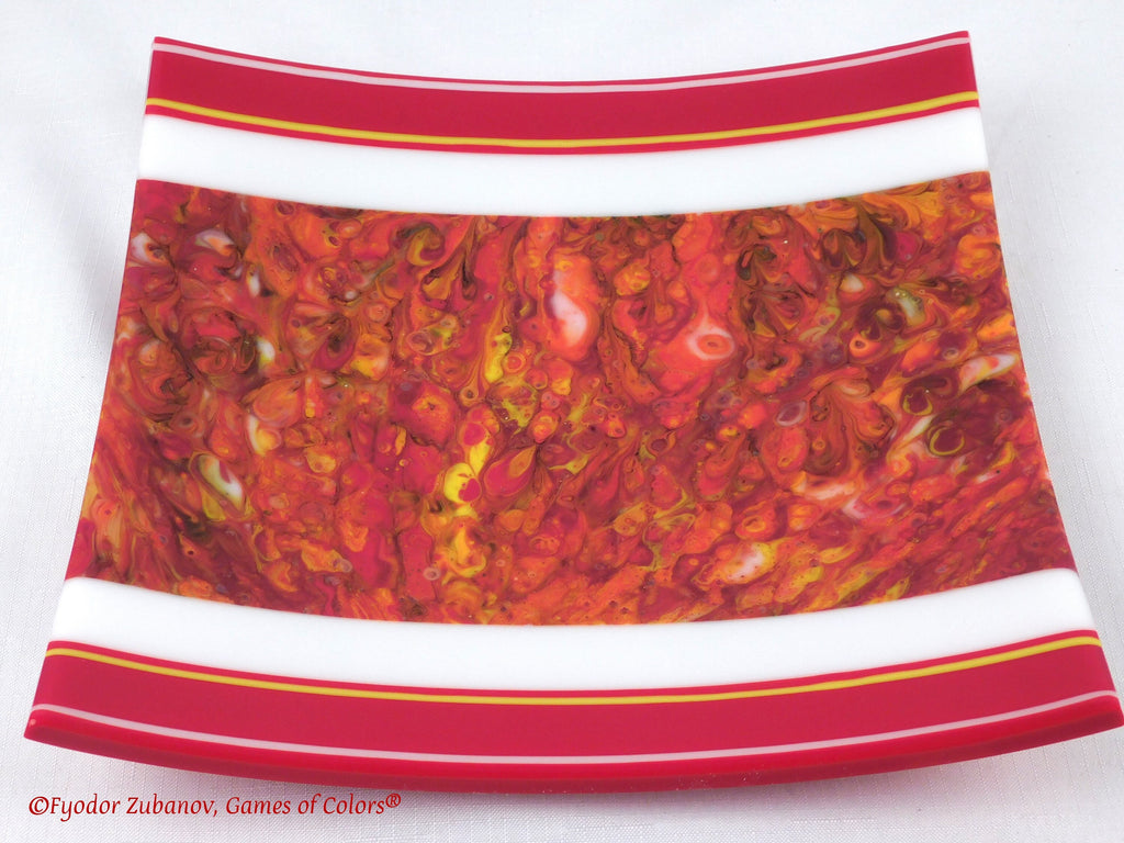 A decorative fused glass plate "Fire taming"