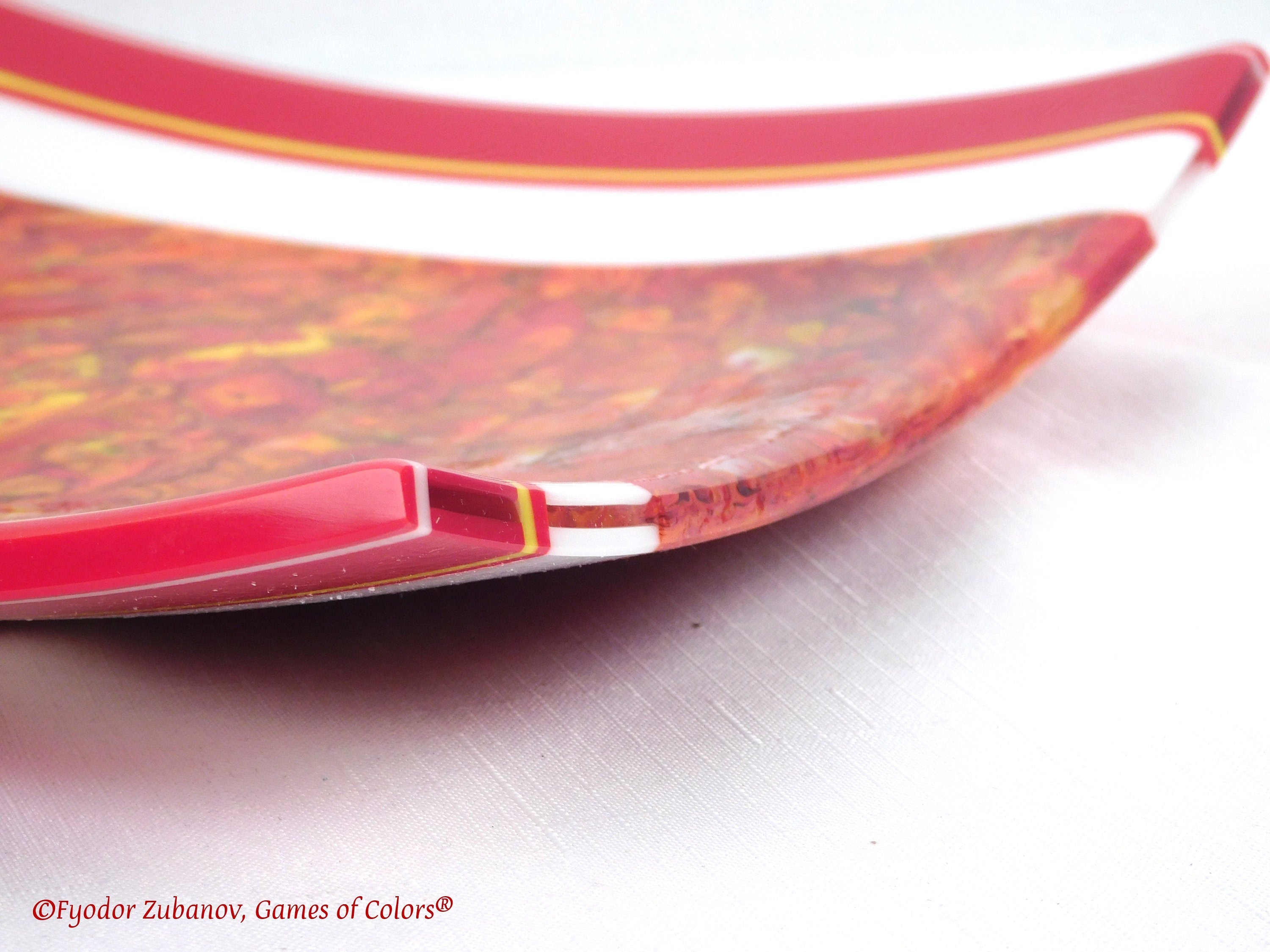 A decorative fused glass plate "Fire taming"