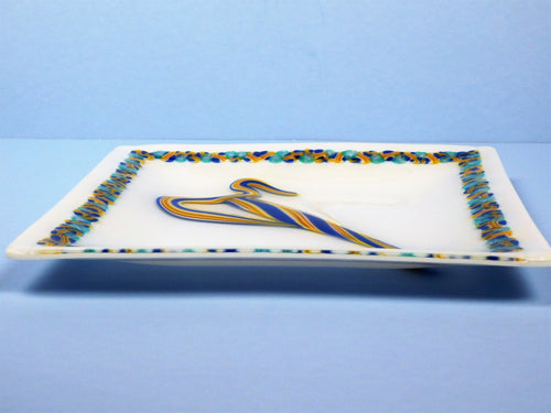 Decorative plate with a colorful abstract design on a blue background