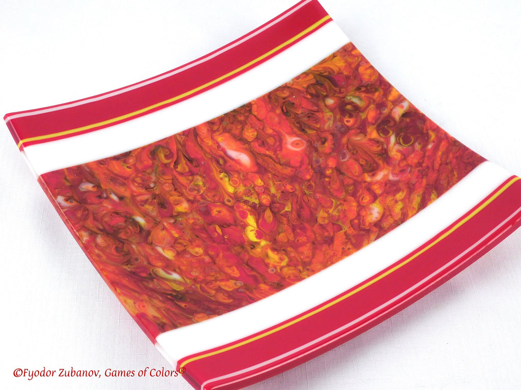 A decorative fused glass plate "Fire taming"