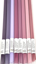 Set of pink and purple glass stringers packed in plastic tubes labeled in the foreground